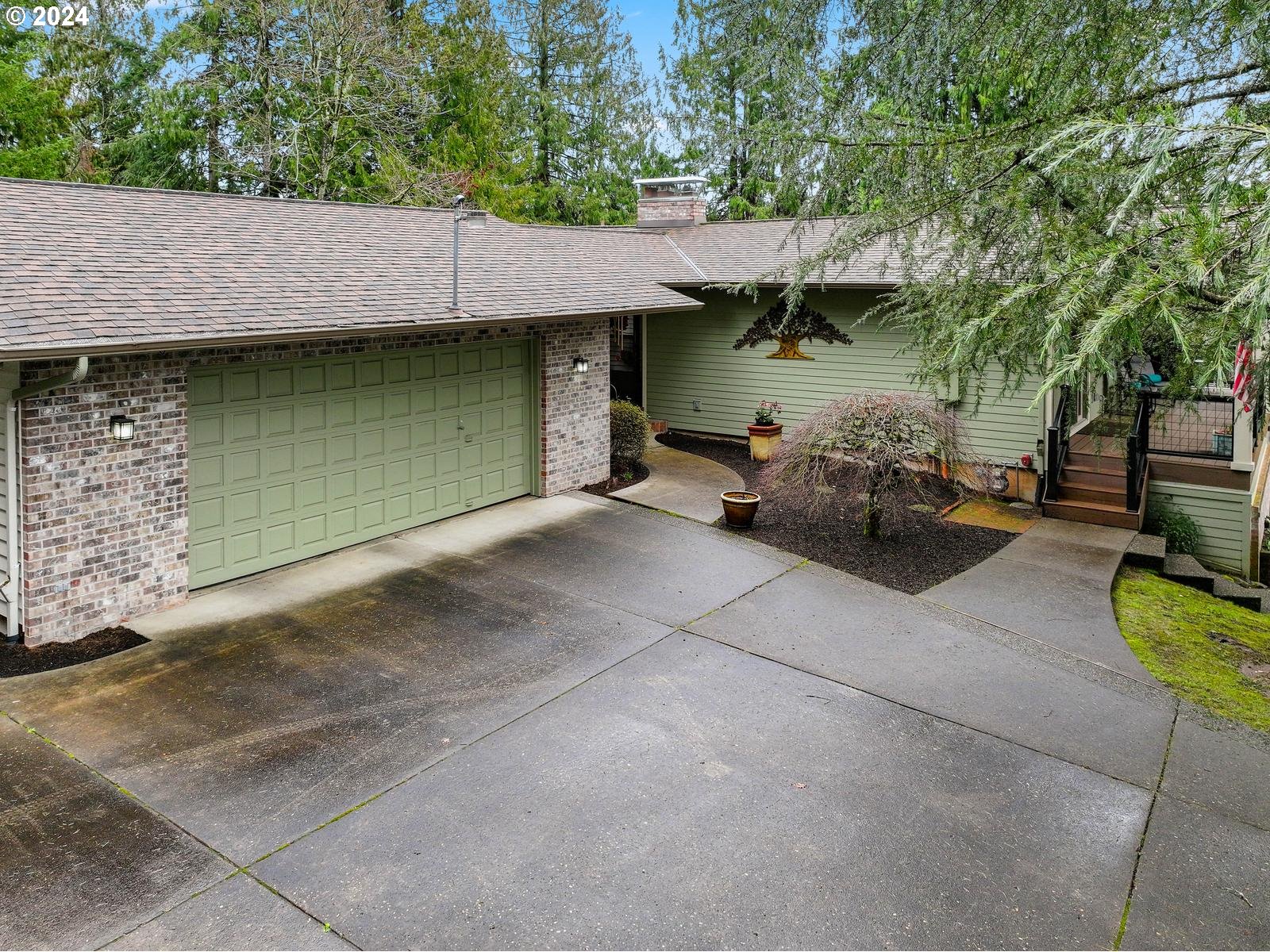 18550 Southeast Jacoby Road Sandy, OR 97055 - Photo 3 of 47 a view of a patio with table and chairs with wooden floor and fence