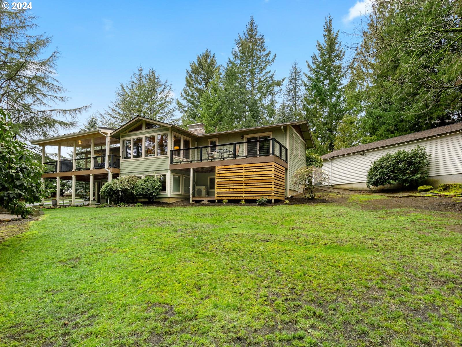 18550 Southeast Jacoby Road Sandy, OR 97055 - Photo 38 of 47 a front view of a house with a garden