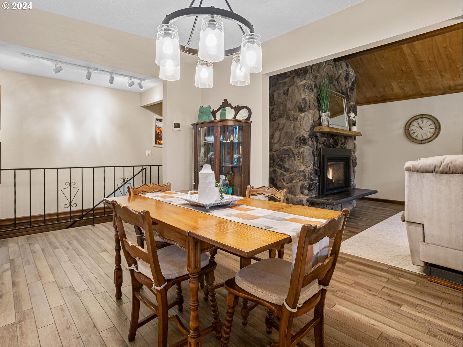 18550 Southeast Jacoby Road Sandy, OR 97055 - Photo 9 of 47 a view of a dining room with furniture and wooden floor