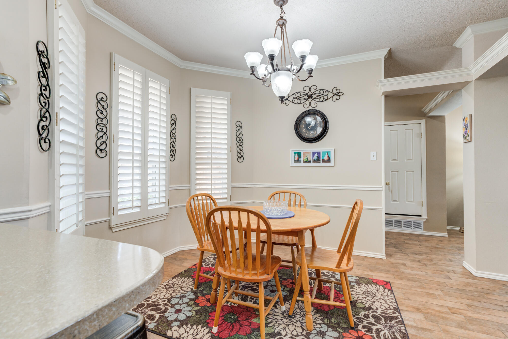 6310 8th Street Lubbock, TX 79416 - Photo 18 of 45 a view of a dining room with furniture window and wooden floor