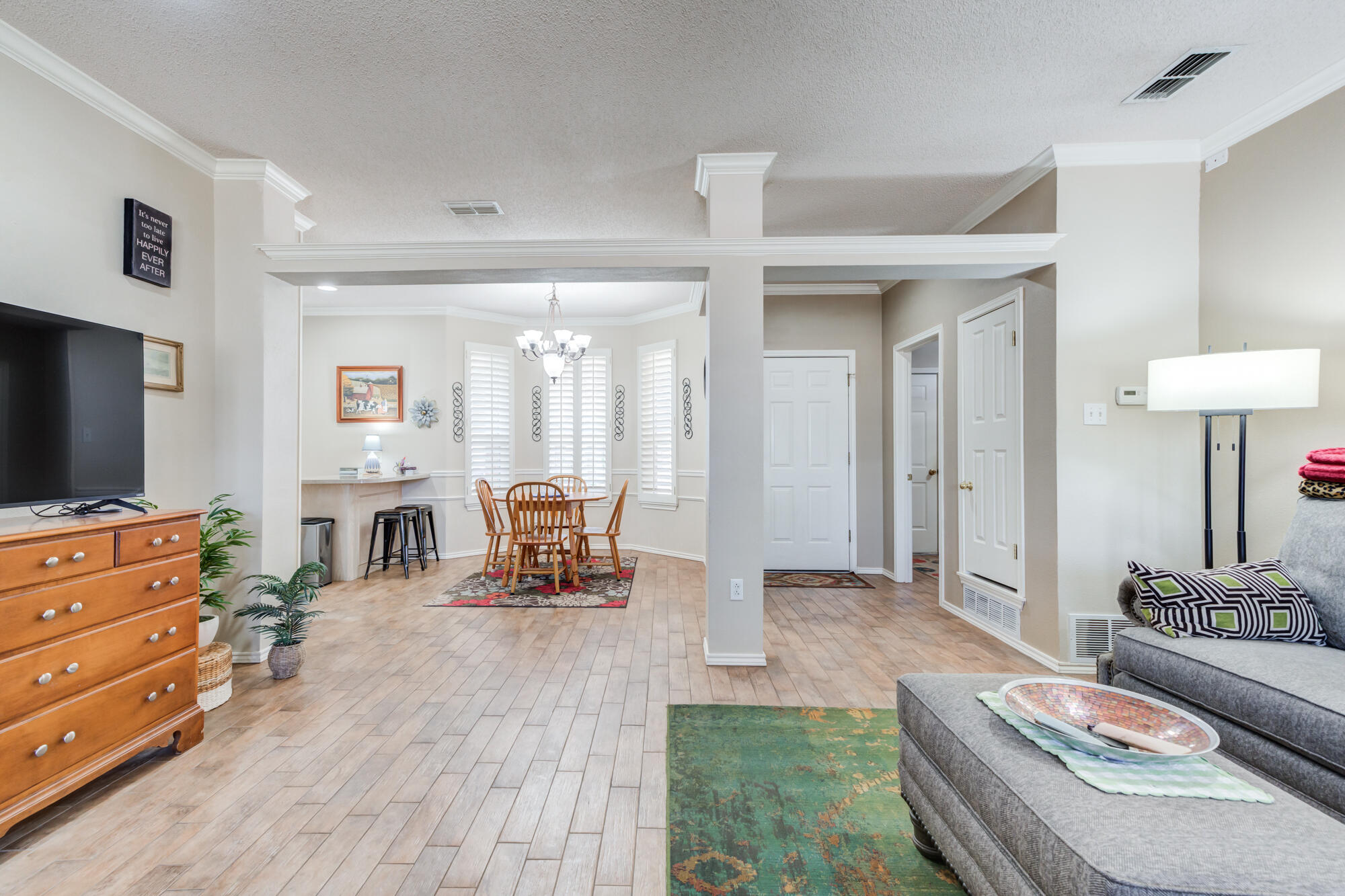 6310 8th Street Lubbock, TX 79416 - Photo 23 of 45 a living room with furniture and a flat screen tv