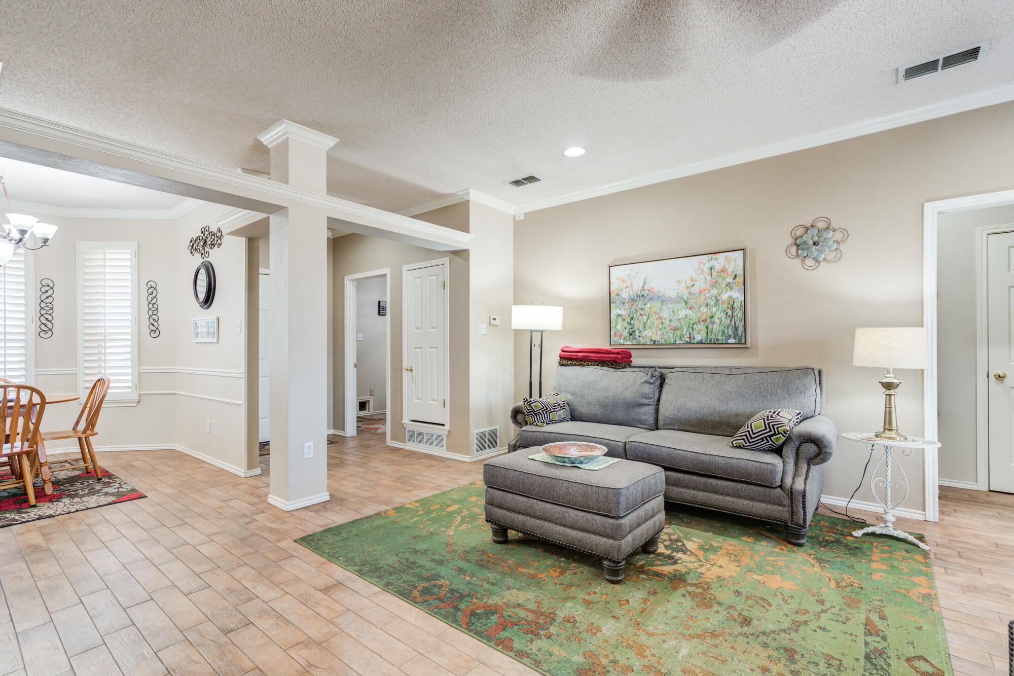 6310 8th Street Lubbock, TX 79416 - Photo 24 of 45 a living room with furniture and a table