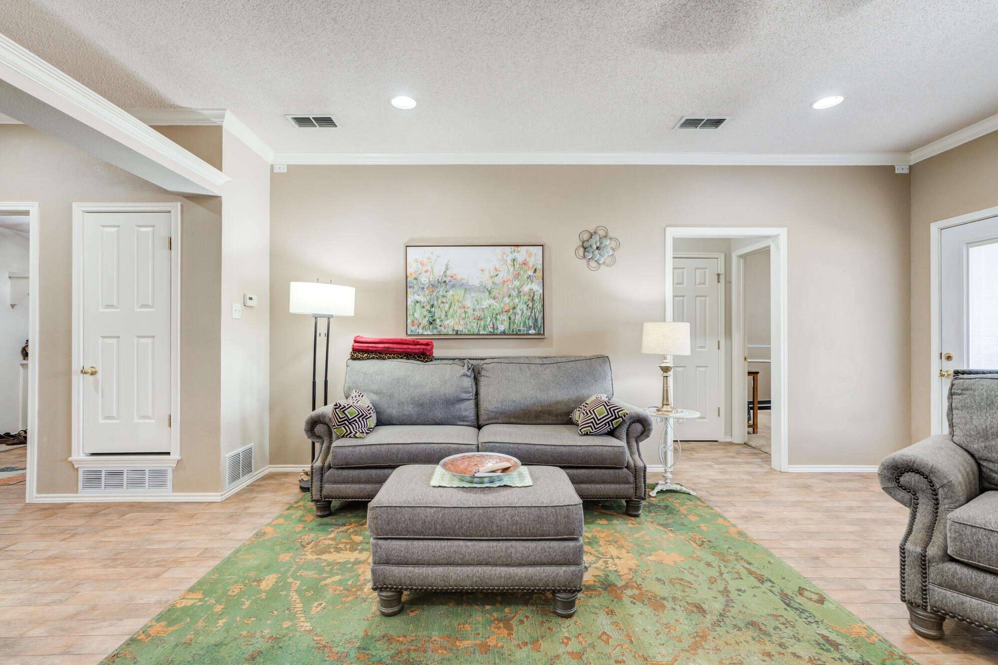 6310 8th Street Lubbock, TX 79416 - Photo 25 of 45 a living room with furniture and a window