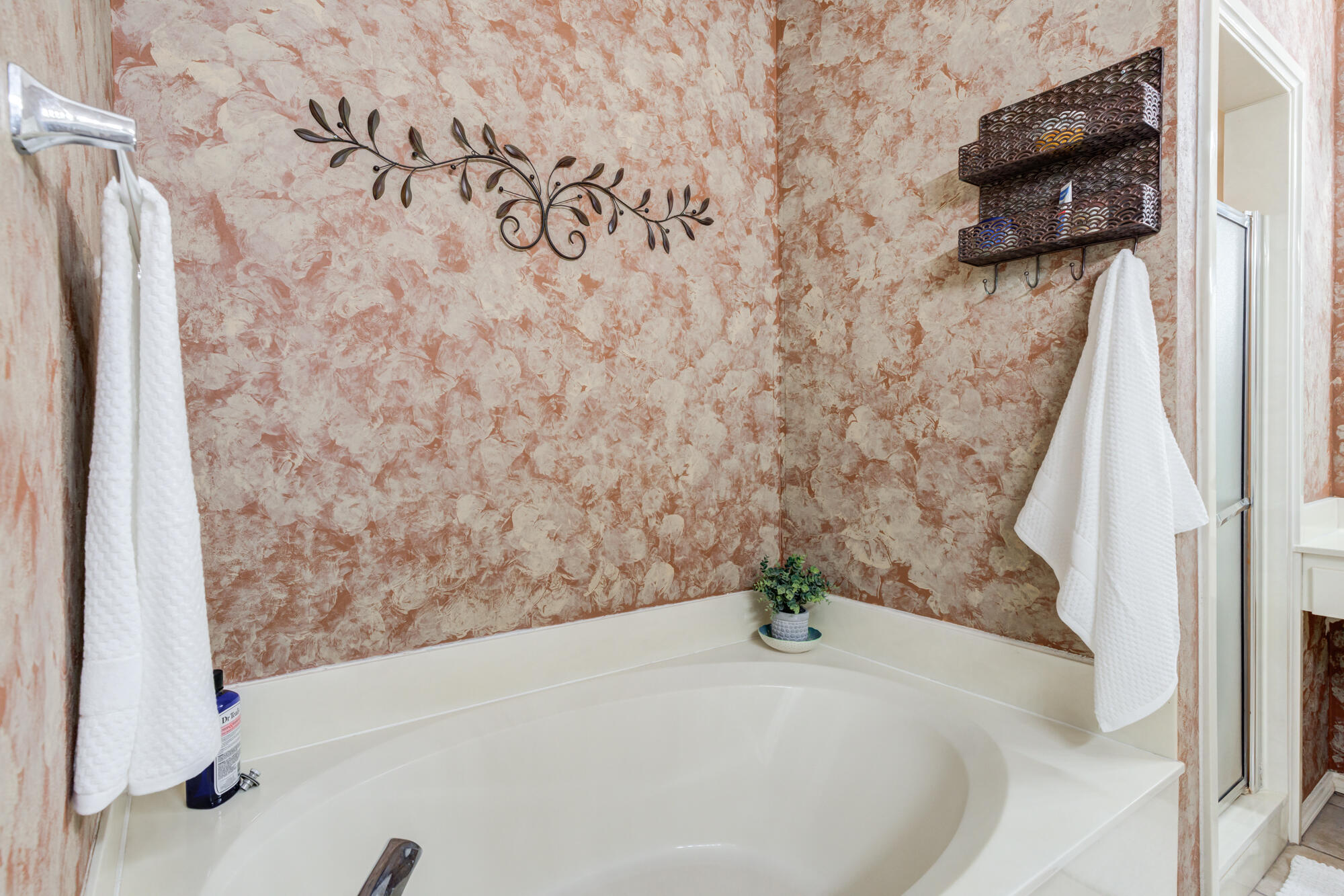 6310 8th Street Lubbock, TX 79416 - Photo 32 of 45 a bathroom with a bathtub and shower
