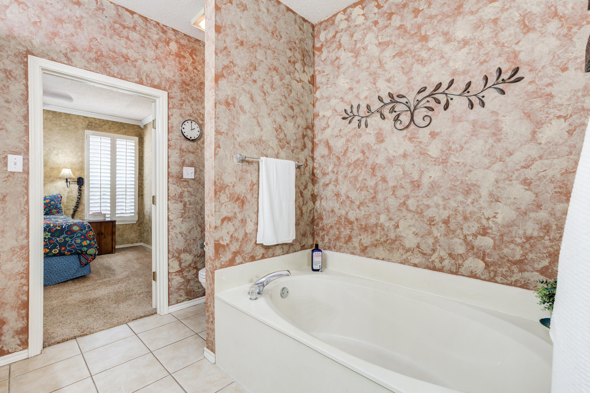 6310 8th Street Lubbock, TX 79416 - Photo 33 of 45 a bathroom with a bathtub and a shower