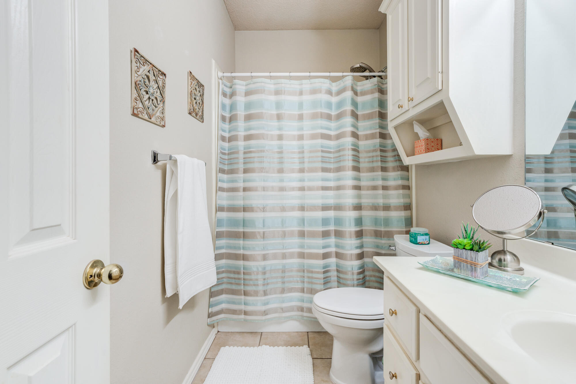 6310 8th Street Lubbock, TX 79416 - Photo 37 of 45 a bathroom with a sink toilet and shower