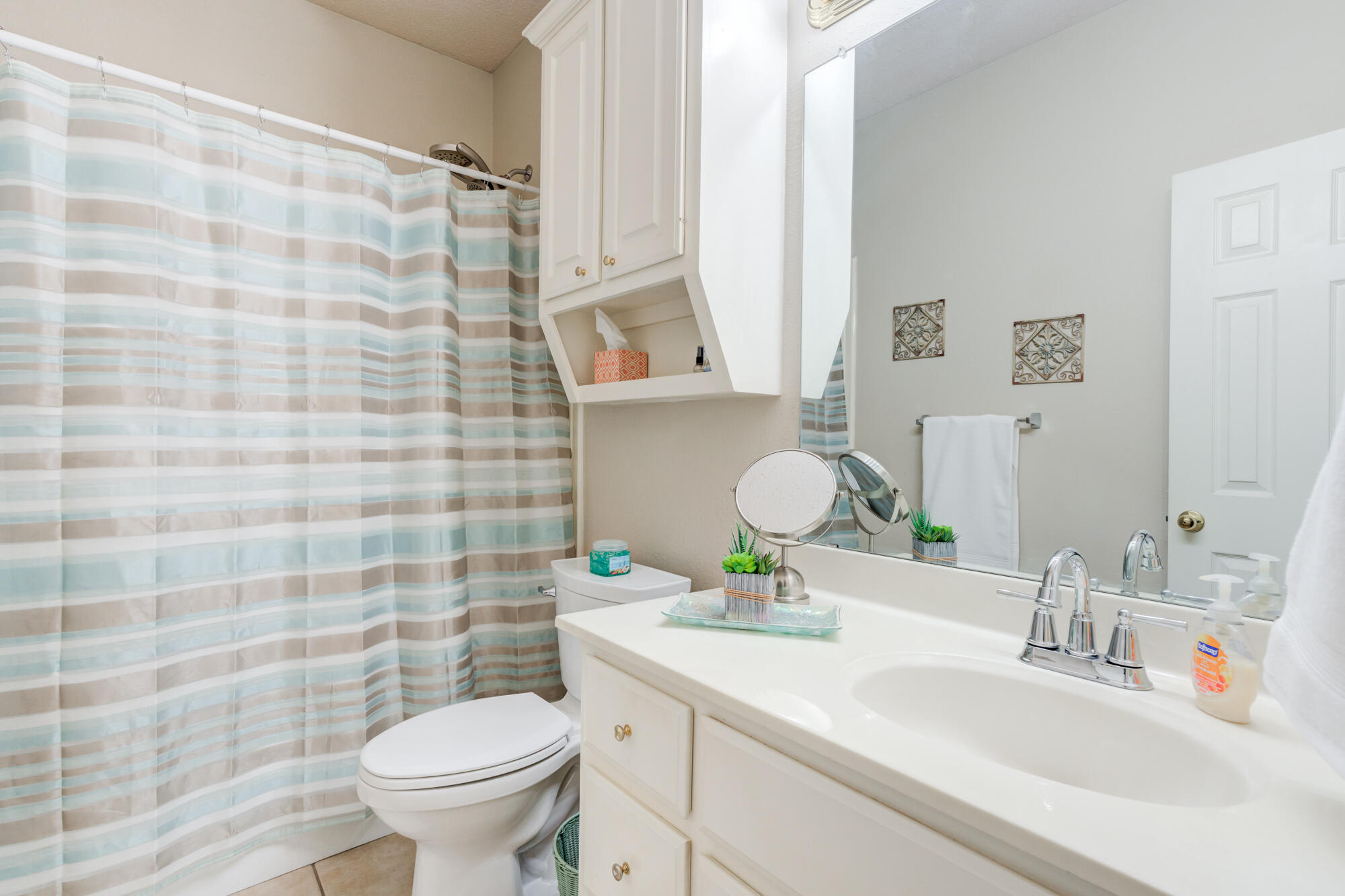 6310 8th Street Lubbock, TX 79416 - Photo 38 of 45 a bathroom with a sink toilet and shower