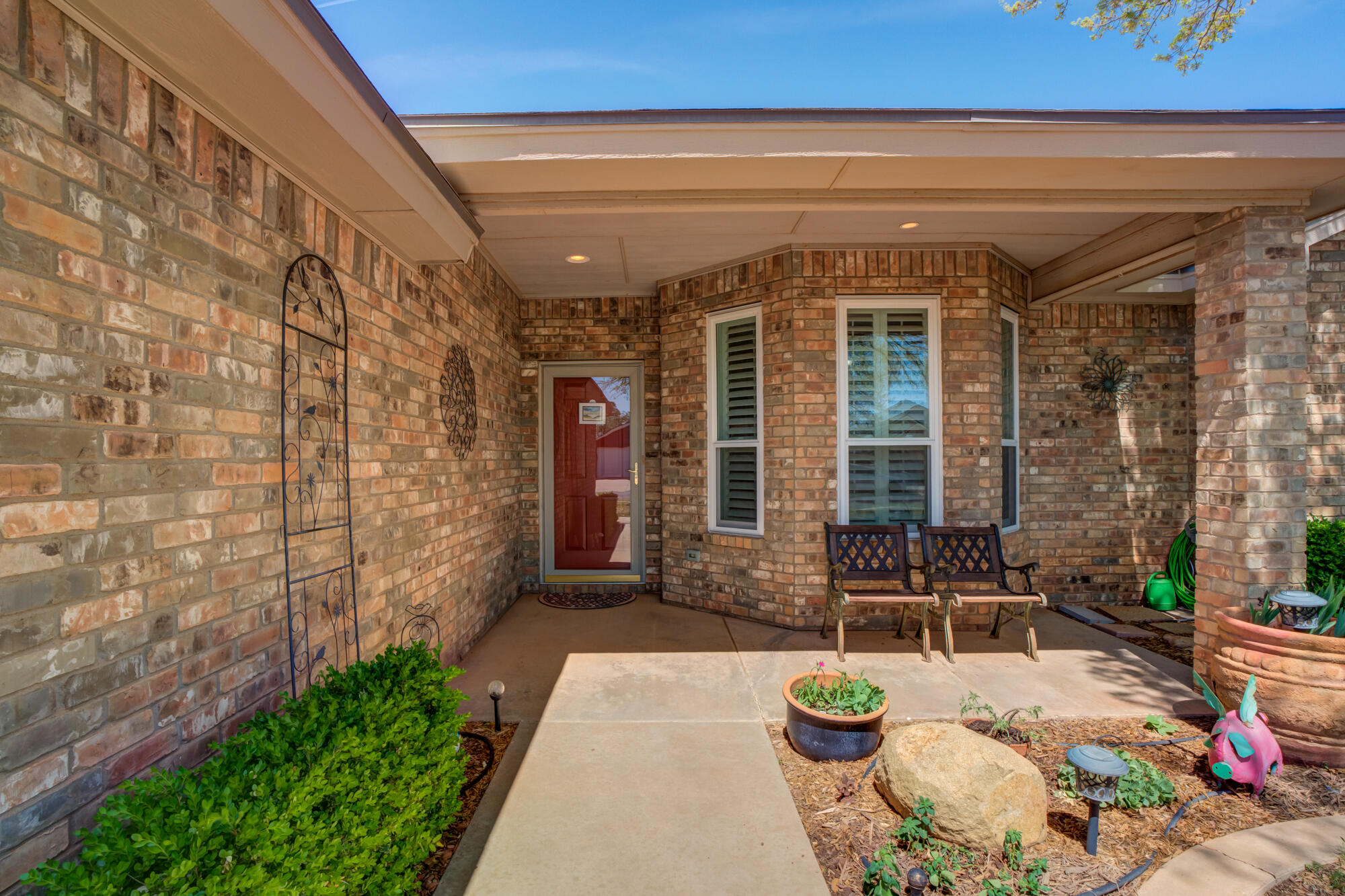 6310 8th Street Lubbock, TX 79416 - Photo 5 of 45 a front view of a house with chairs