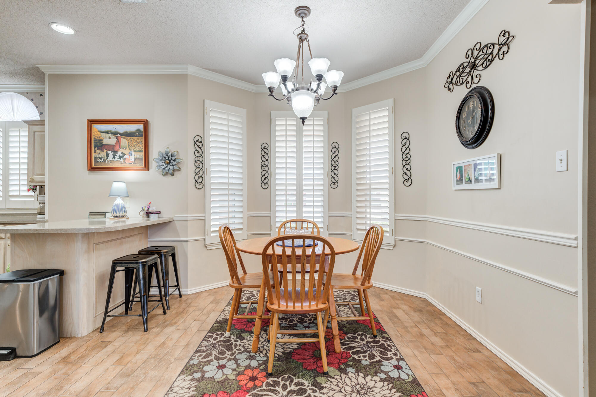 6310 8th Street Lubbock, TX 79416 - Photo 9 of 45 a view of a dining room with furniture and chandelier