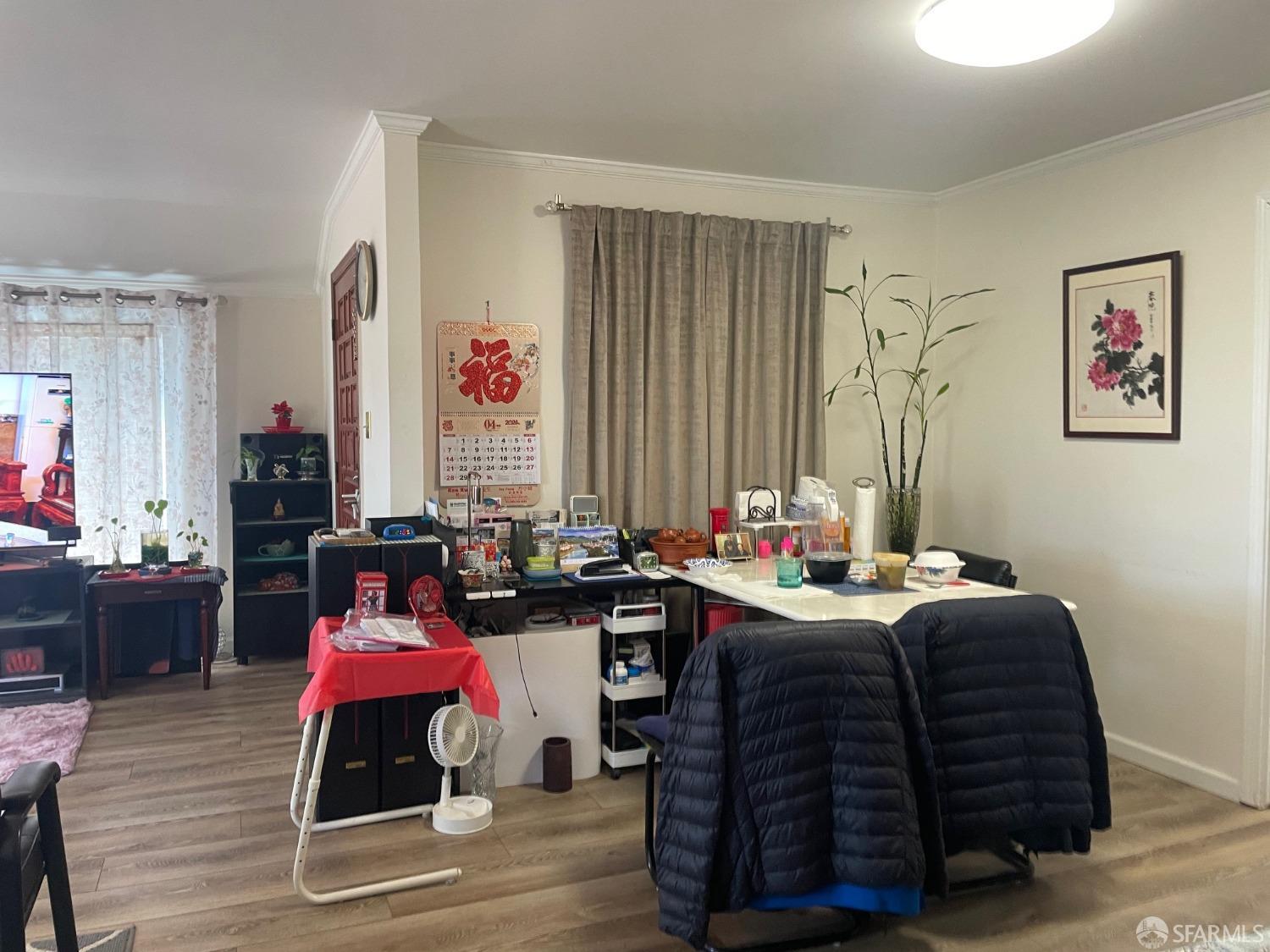 168 Park Boulevard Millbrae, CA 94030 - Photo 16 of 19 a room with a desk chairs and wooden floor