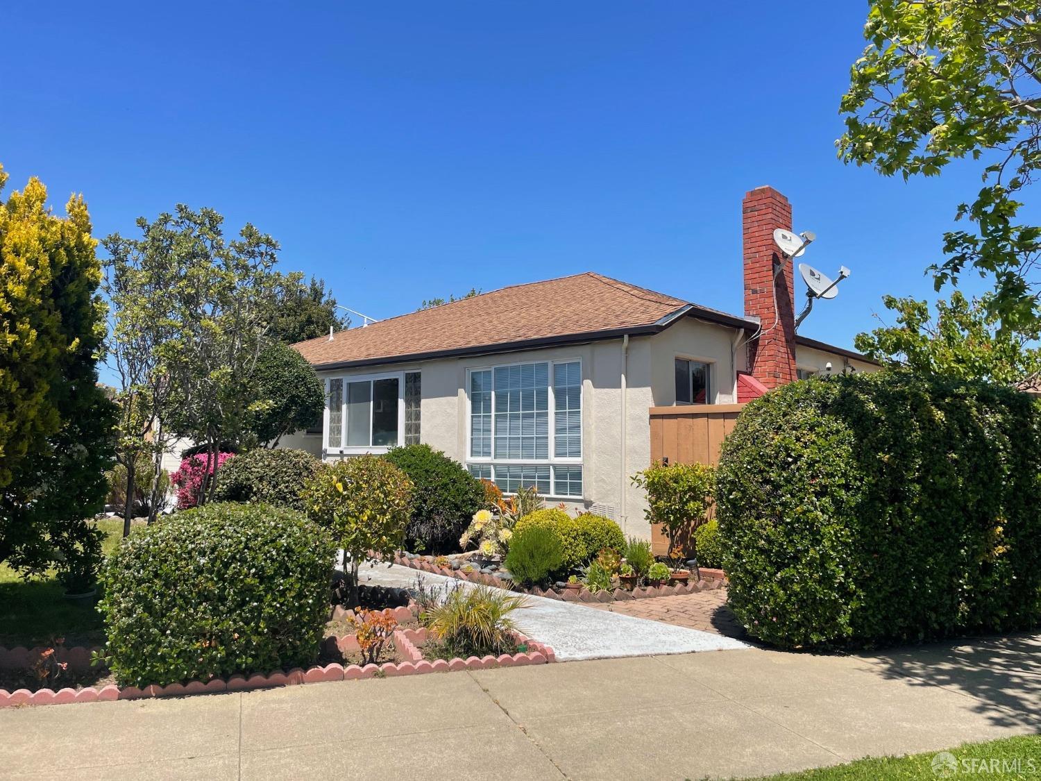 168 Park Boulevard Millbrae, CA 94030 - Photo 6 of 19 a front view of a house with a yard