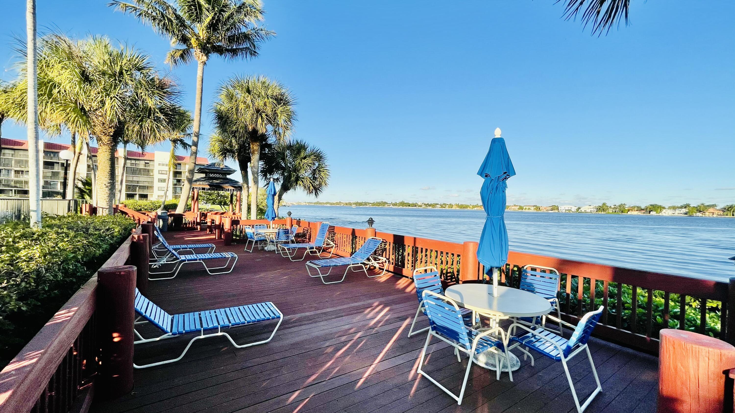 104 Half Moon Circle, Unit B2 Hypoluxo, FL 33462 - Photo 19 of 54 a outdoor space with furniture