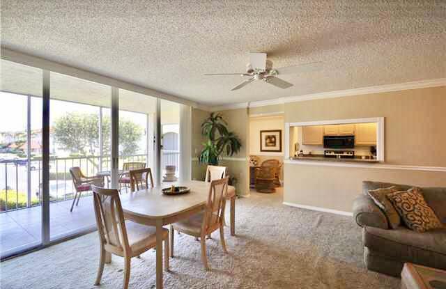 104 Half Moon Circle, Unit B2 Hypoluxo, FL 33462 - Photo 31 of 54 a view of a dining room with furniture window and outside view