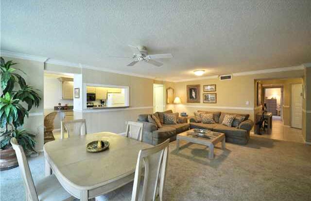 104 Half Moon Circle, Unit B2 Hypoluxo, FL 33462 - Photo 32 of 54 a view of a dining room with furniture