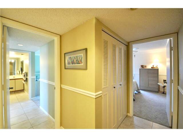 104 Half Moon Circle, Unit B2 Hypoluxo, FL 33462 - Photo 40 of 54 a bathroom with a glass door shower and a sink