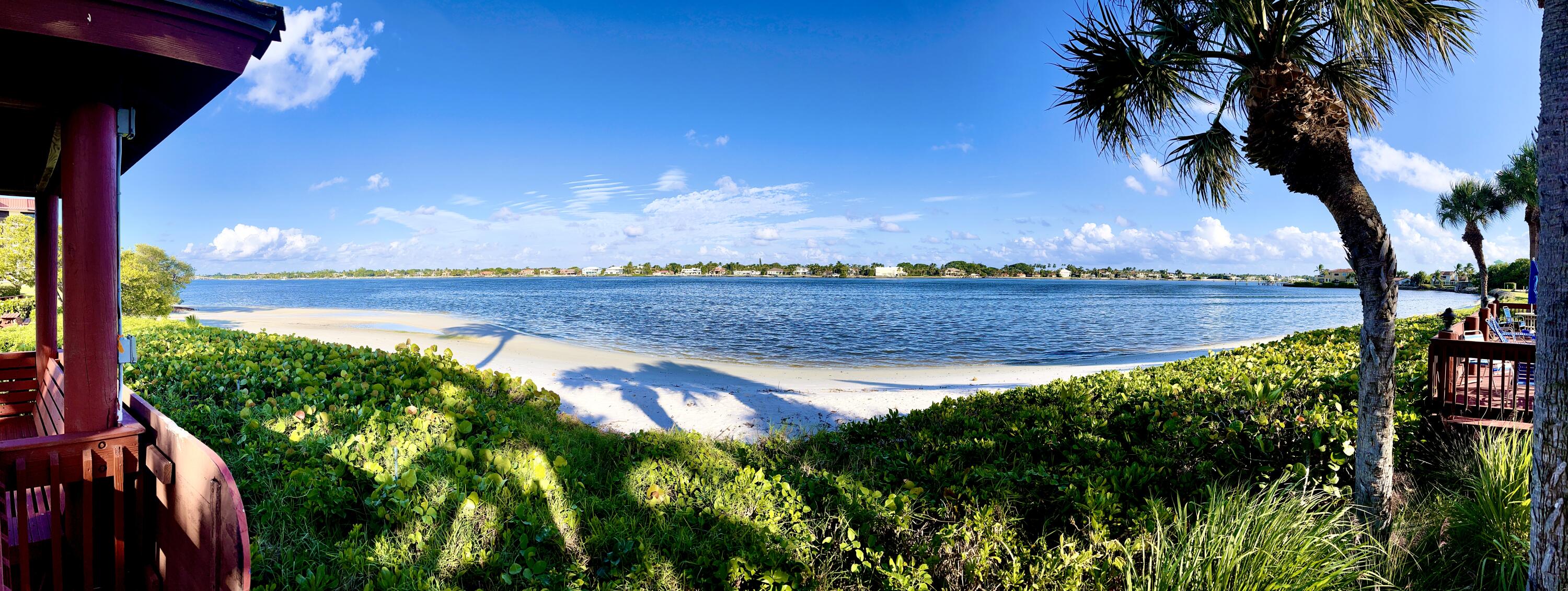 104 Half Moon Circle, Unit B2 Hypoluxo, FL 33462 - Photo 46 of 54 a view of a lake with a big yard