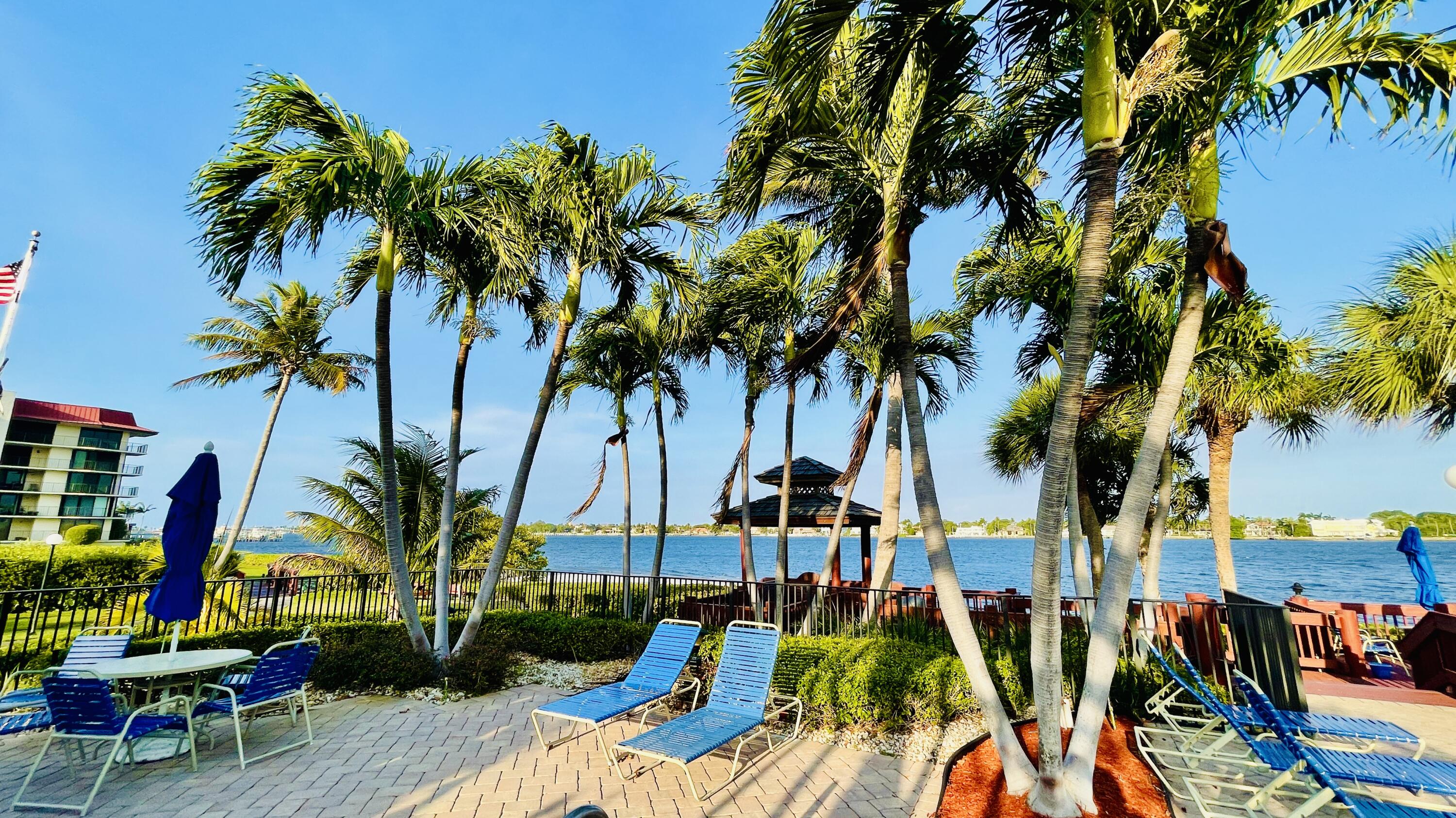 104 Half Moon Circle, Unit B2 Hypoluxo, FL 33462 - Photo 10 of 54 an ocean view with palm trees