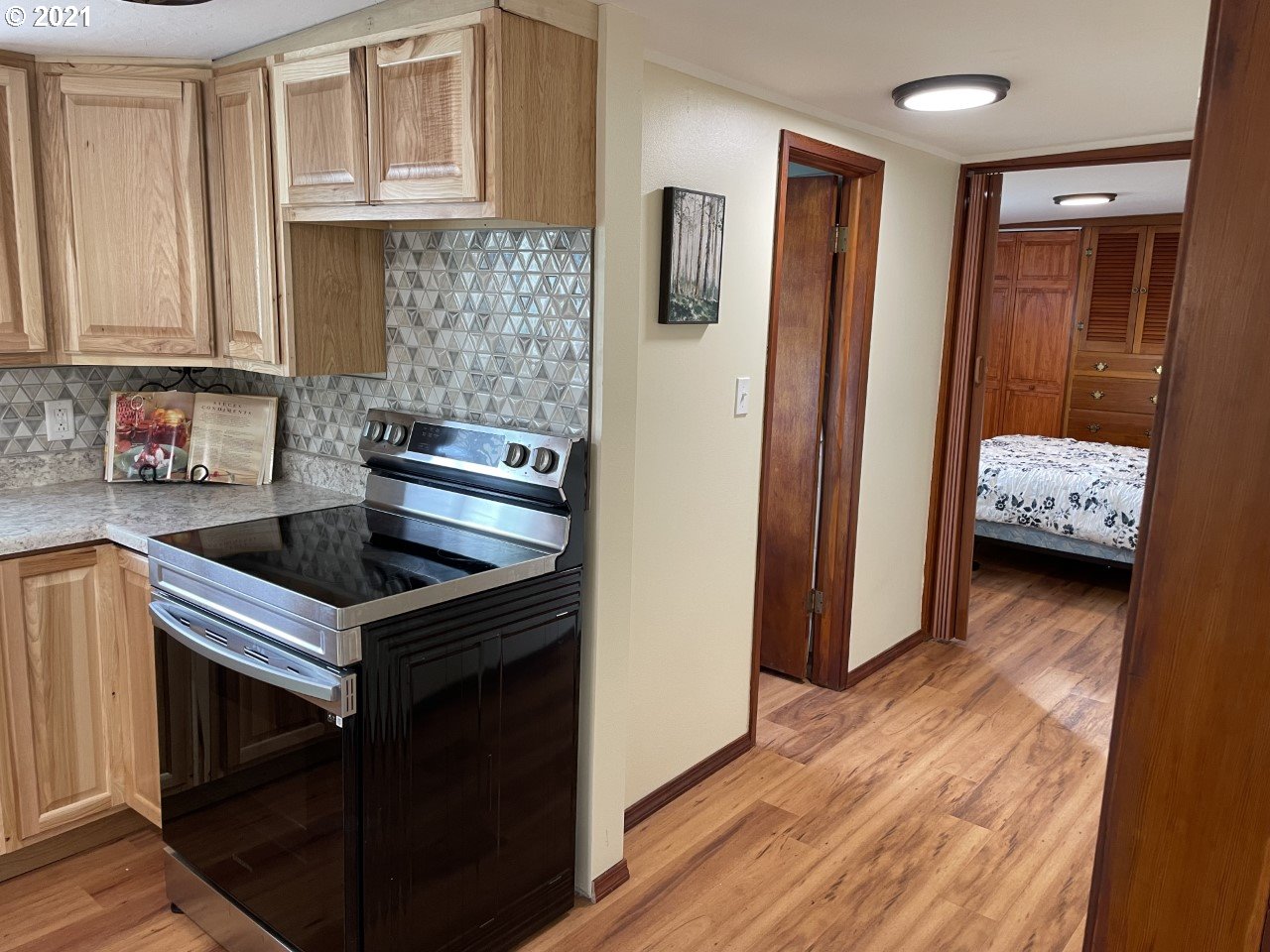 1483 E Street Springfield, OR 97477 - Photo 14 of 26 a kitchen with stainless steel appliances granite countertop a stove and a refrigerator