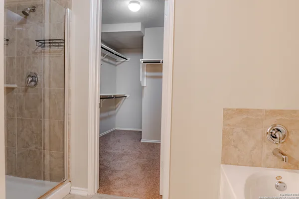 a bathroom with a bathtub and shower