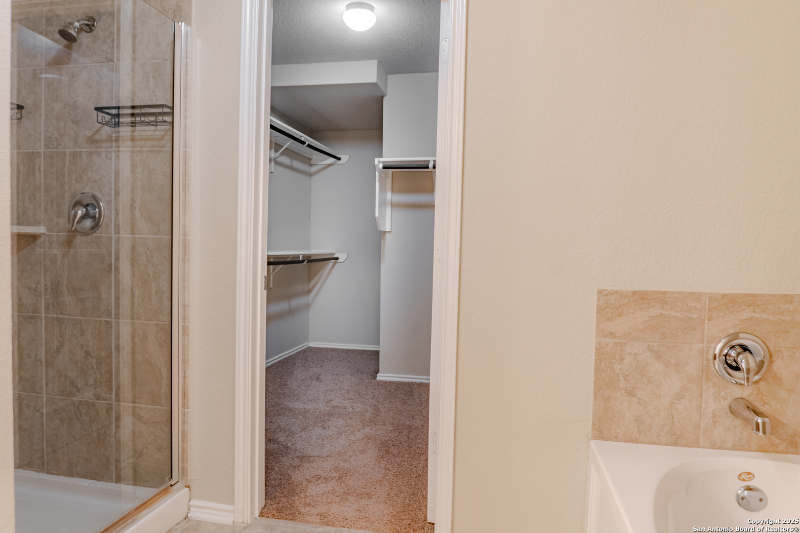 12236 Bening Schertz, TX 78154 - Photo 11 of 16 a bathroom with a bathtub and shower