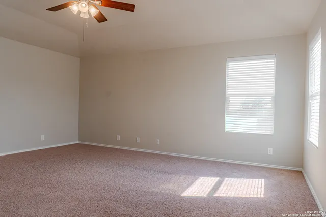 a view of an empty room and window