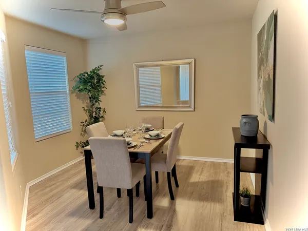 a view of a dining room with furniture and wooden floor