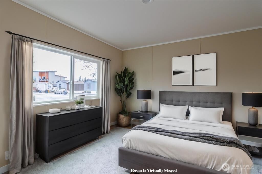 840 West 1st Street, Unit 29 Cheney, WA 99004 - Photo 14 of 20 a bedroom with a large bed and a large window