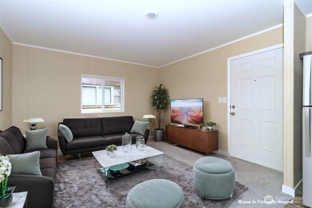 840 West 1st Street, Unit 29 Cheney, WA 99004 - Photo 3 of 20 a living room with furniture and a window