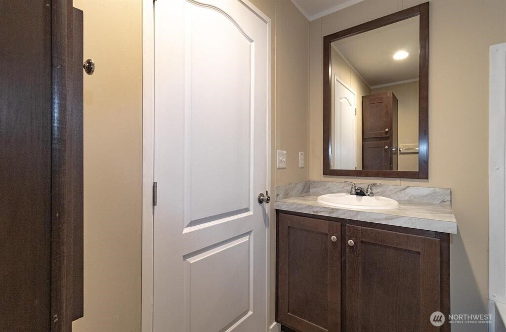 840 West 1st Street, Unit 29 Cheney, WA 99004 - Photo 10 of 20 a bathroom with a sink and a mirror