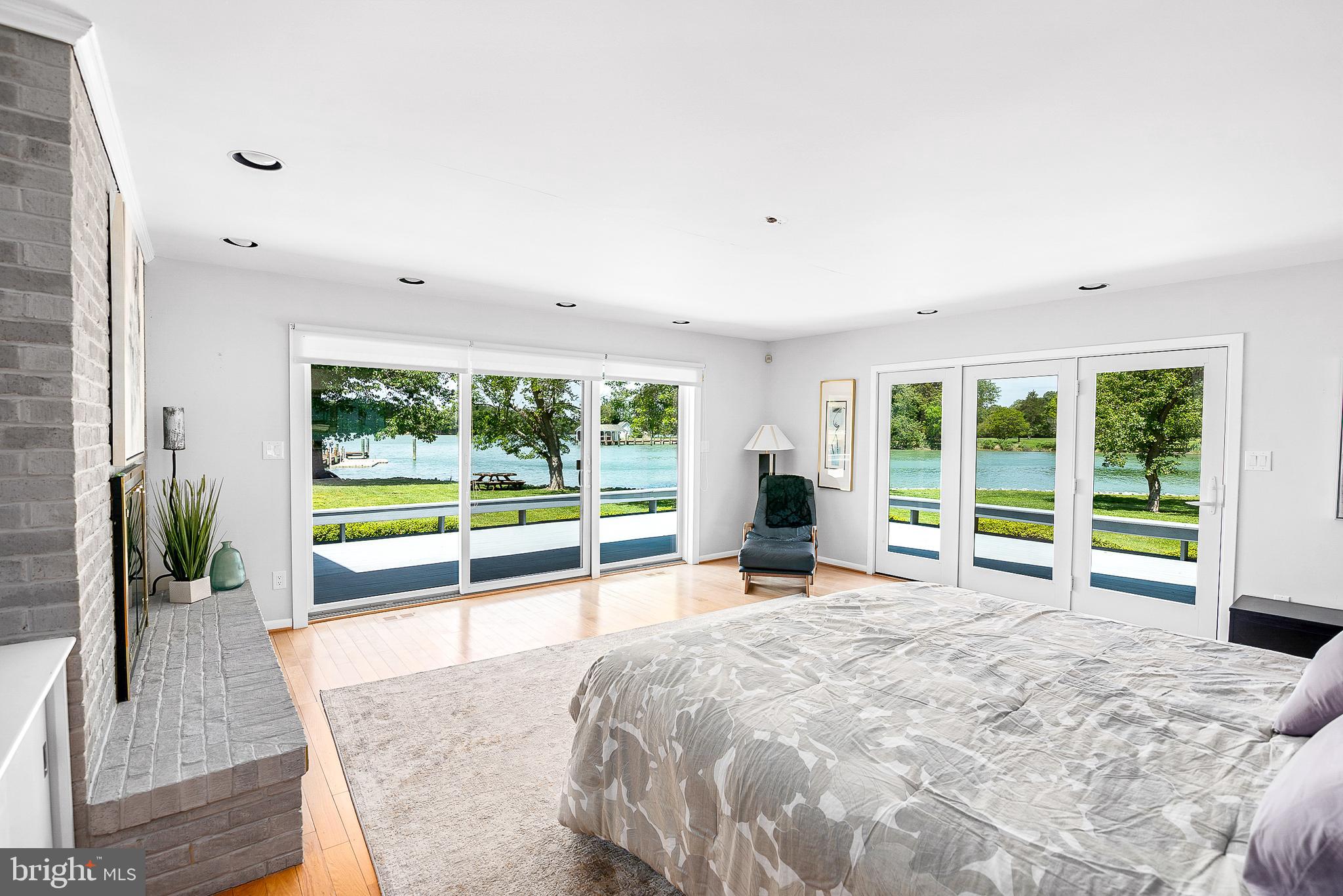 26282 Deep Water Harbor Road Easton, MD 21601 - Photo 20 of 53 a view of a room with wooden floor and windows