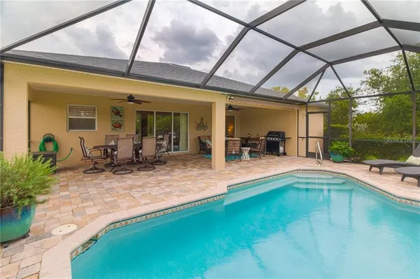 a view of swimming pool with outdoor seating