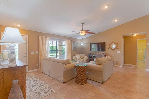 a living room with furniture and a large window