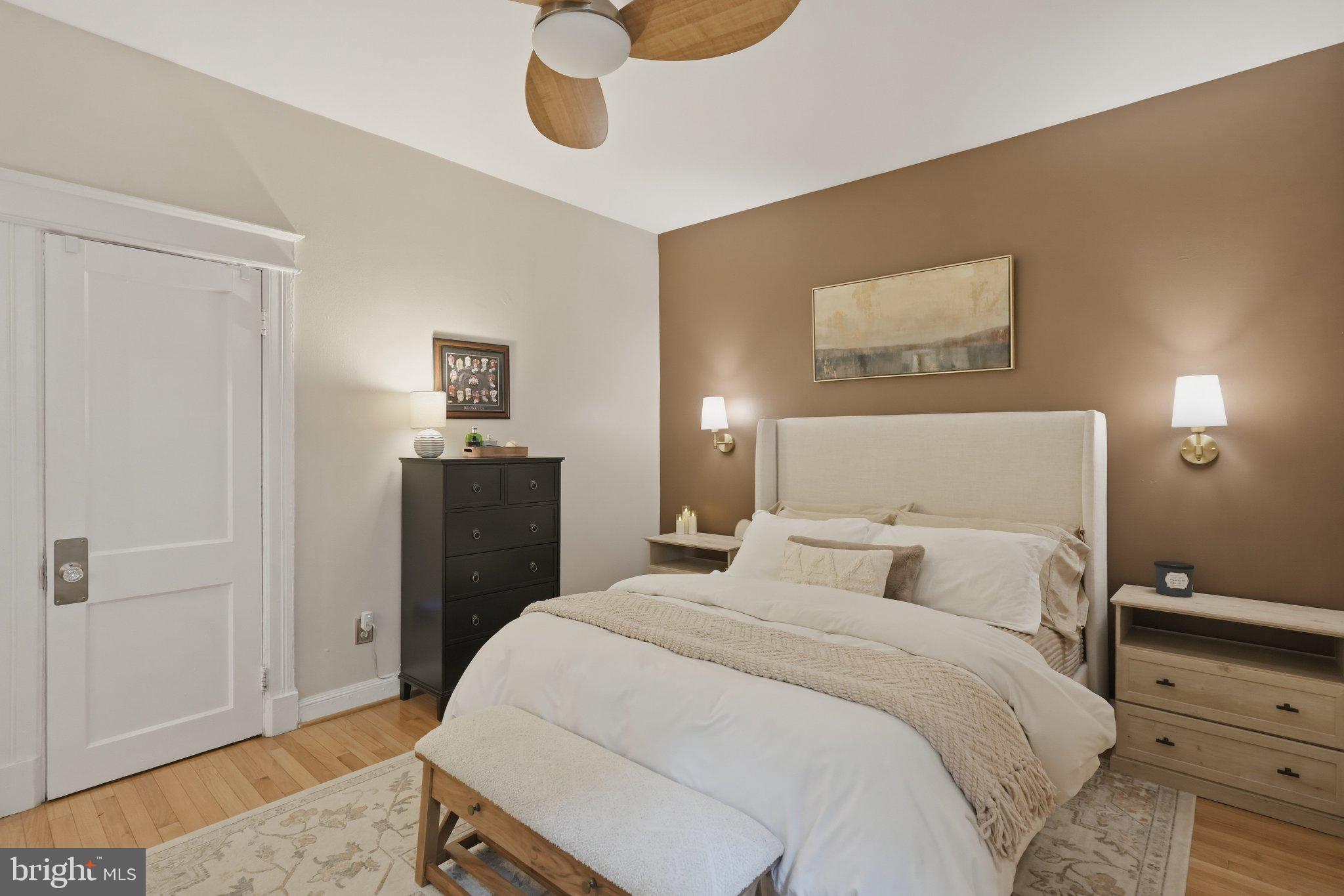 2010 Kalorama Road Northwest, Unit 304 Washington, DC 20009 - Photo 16 of 23 a bedroom with a bed and a lamp on the dresser