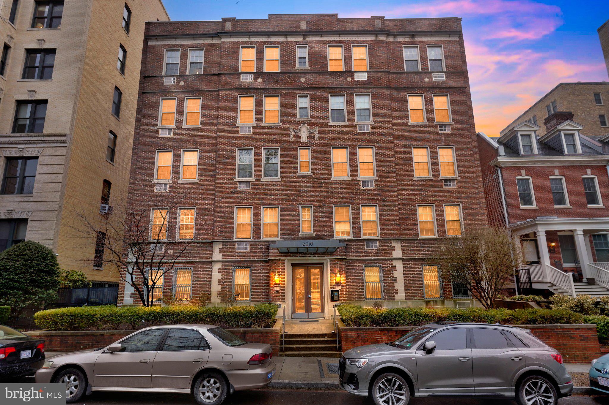 2010 Kalorama Road Northwest, Unit 304 Washington, DC 20009 - Photo 22 of 23 a view of cars parked in front of a brick building