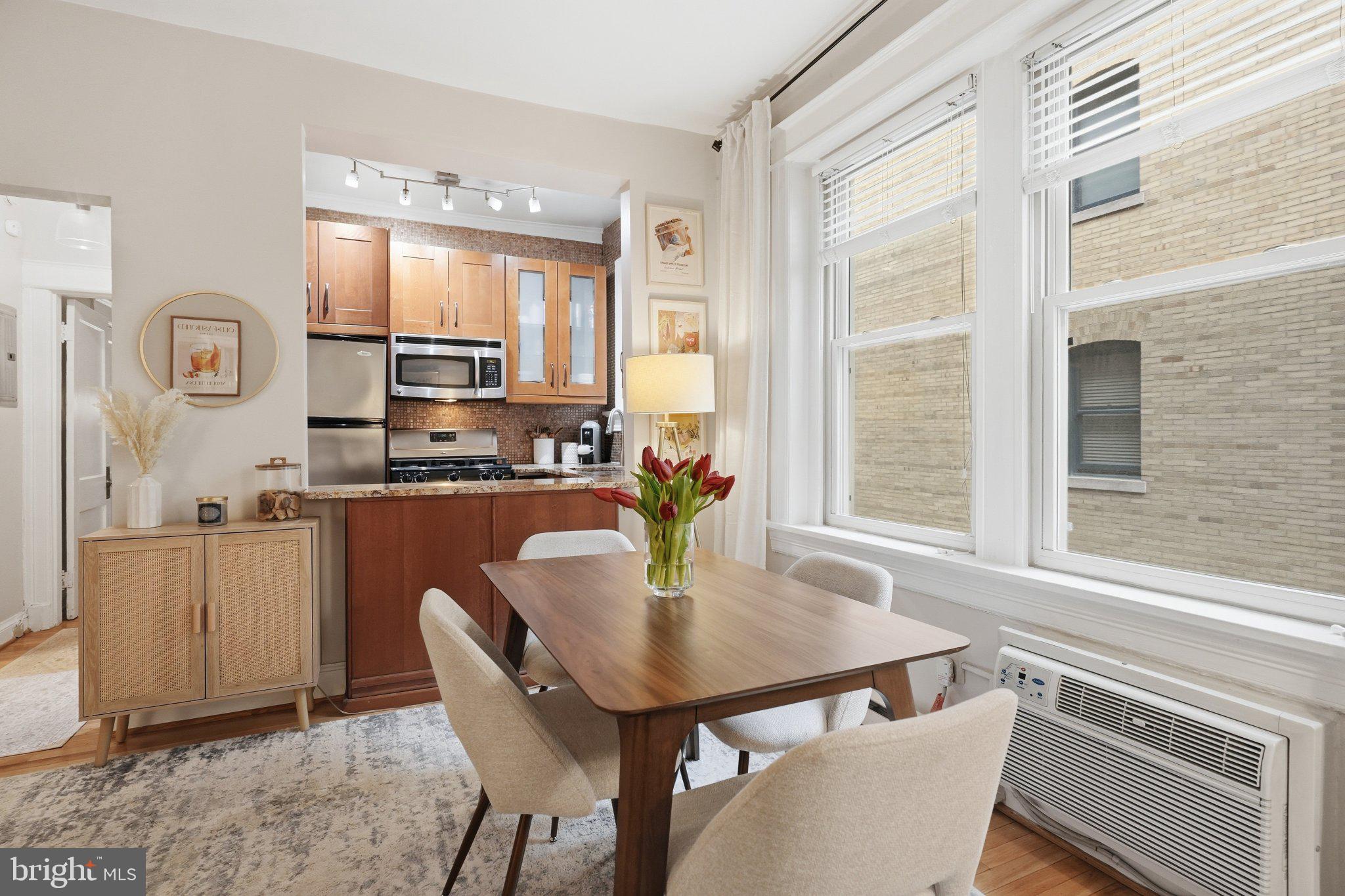 2010 Kalorama Road Northwest, Unit 304 Washington, DC 20009 - Photo 9 of 23 a kitchen with a table and chairs in it