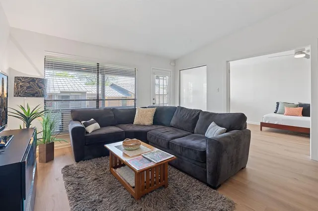 a living room with furniture and a large window