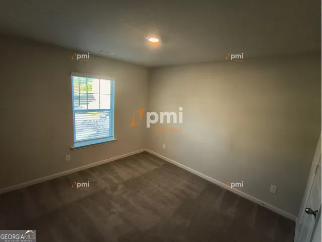 an empty room with a empty space and windows