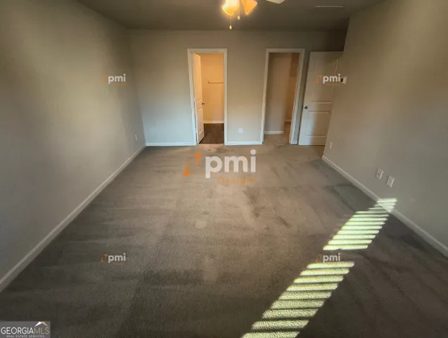 a view of an empty room with stairs