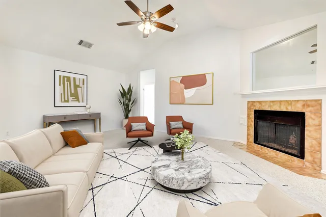 a living room with furniture and a fireplace