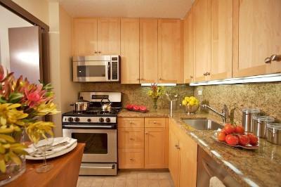 Undisclosed Address Manhattan, NY 10010 - Photo 6 of 8 a kitchen with stainless steel appliances a stove a sink and white cabinets
