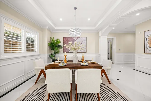 a kitchen with kitchen island granite countertop a table and chairs in it