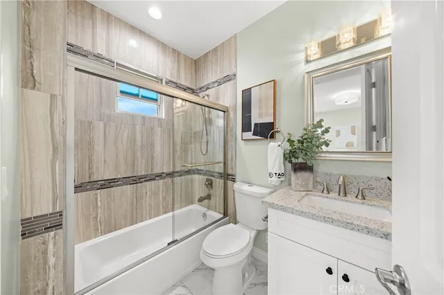 a bedroom with a bed and a mirror