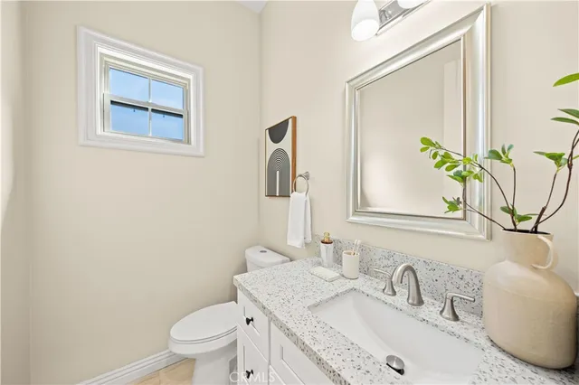 a view of a livingroom with furniture and a window