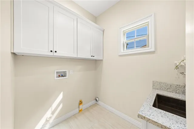 a bedroom with a bed and a lamp