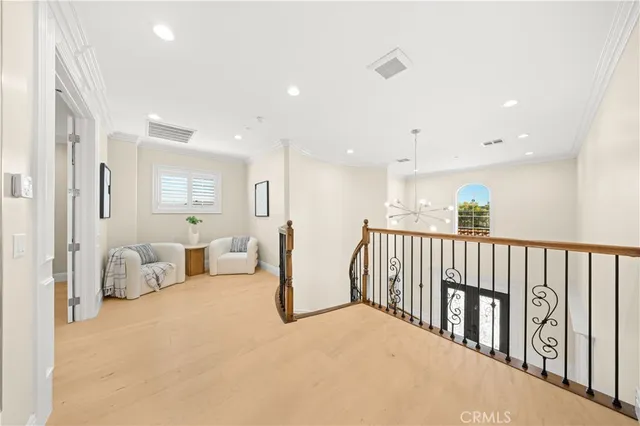 a bedroom with a bed and a potted plant