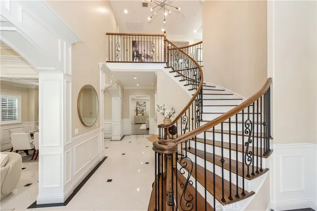 a view of entryway livingroom and hall with wooden floor