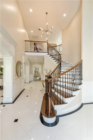 a view of a livingroom with furniture and stairs