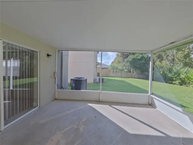 a view of a garden with an outdoor seating