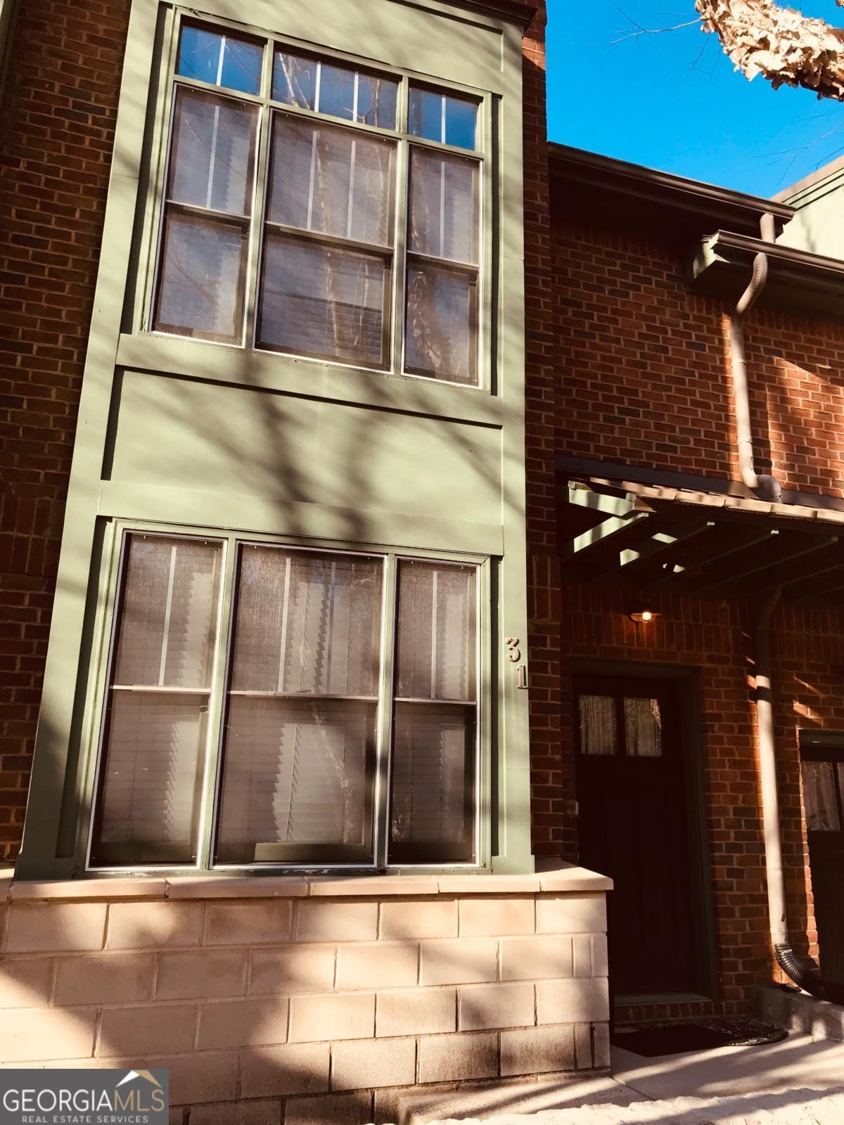 a view of building with glass windows