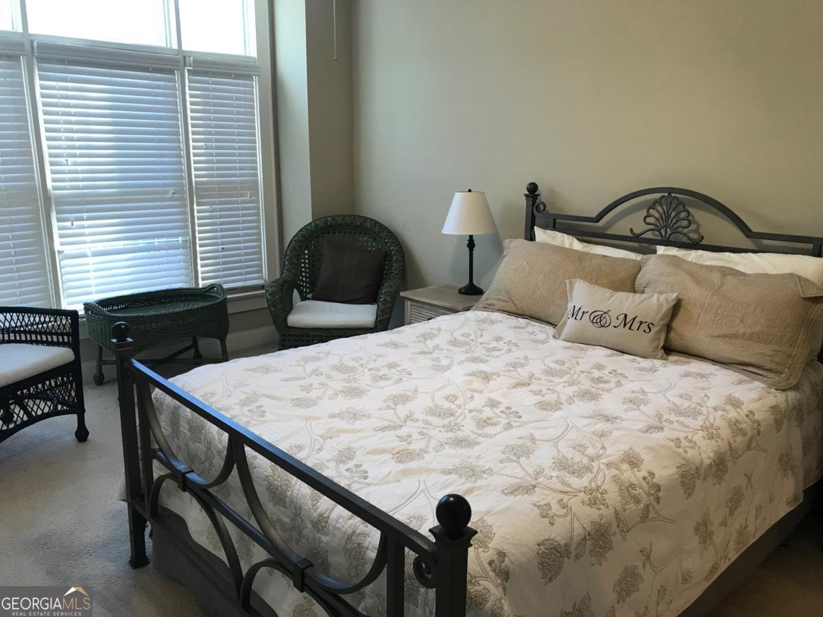 1500 Timothy Road, Unit D31 Athens, GA 30606 - Photo 15 of 19 a bedroom with a bed and a table